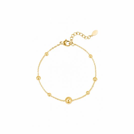 Gouden bolletjes armband van stainless steel, productfoto op witte achtergrond